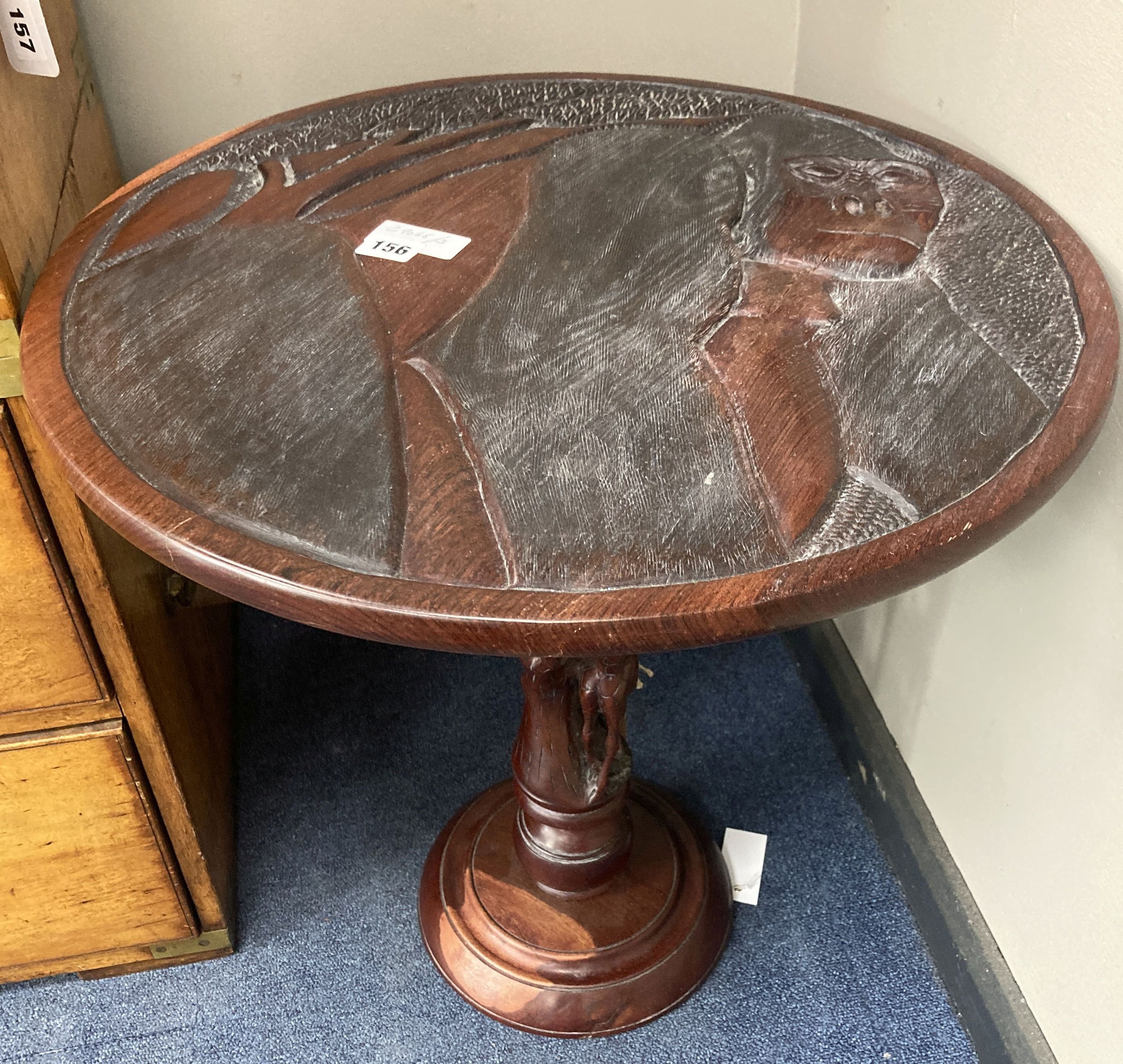 An African carved hardwood pedestal table, diameter 54cm, height 57cm